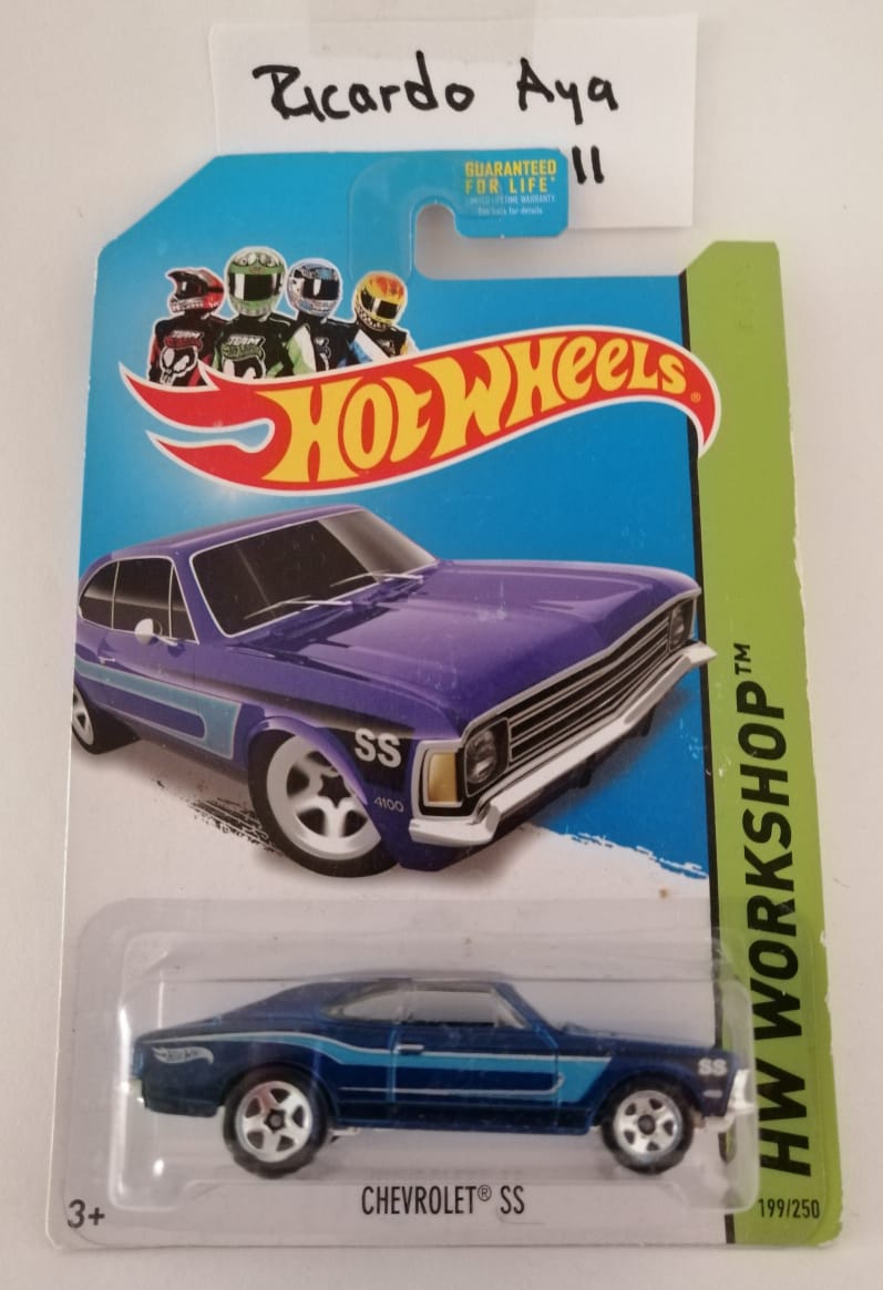 Front of satchel with blue canvas body, black straps and handle, drawstring top, and front zipper pouch.