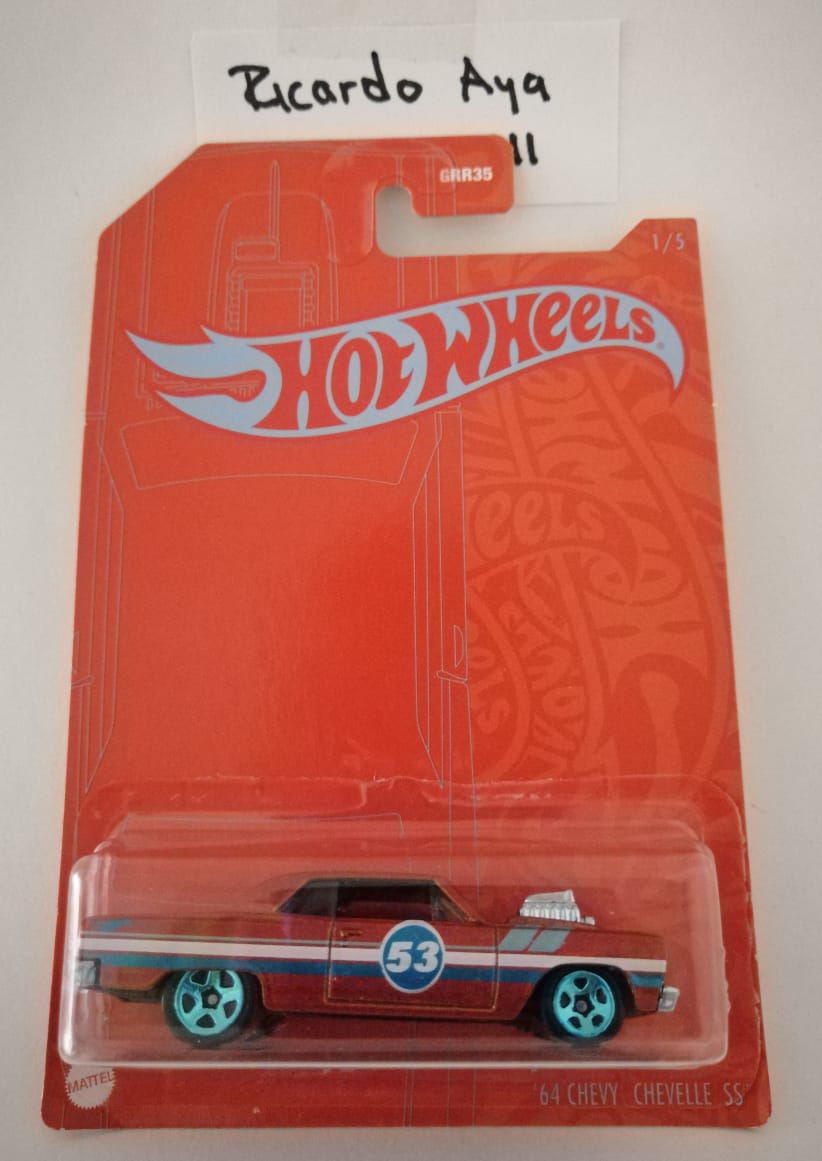 Front of satchel with blue canvas body, black straps and handle, drawstring top, and front zipper pouch.