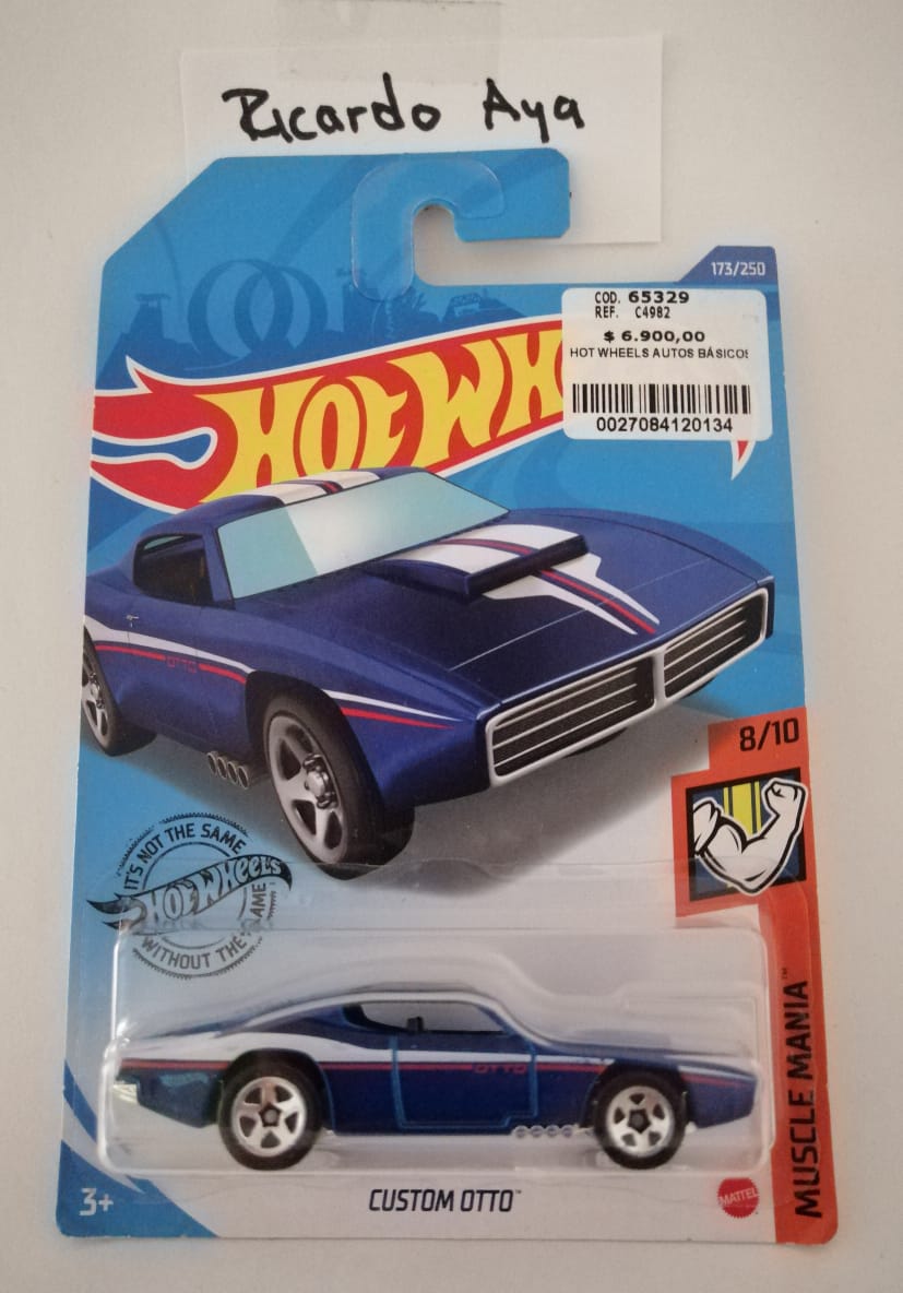 Front of satchel with blue canvas body, black straps and handle, drawstring top, and front zipper pouch.