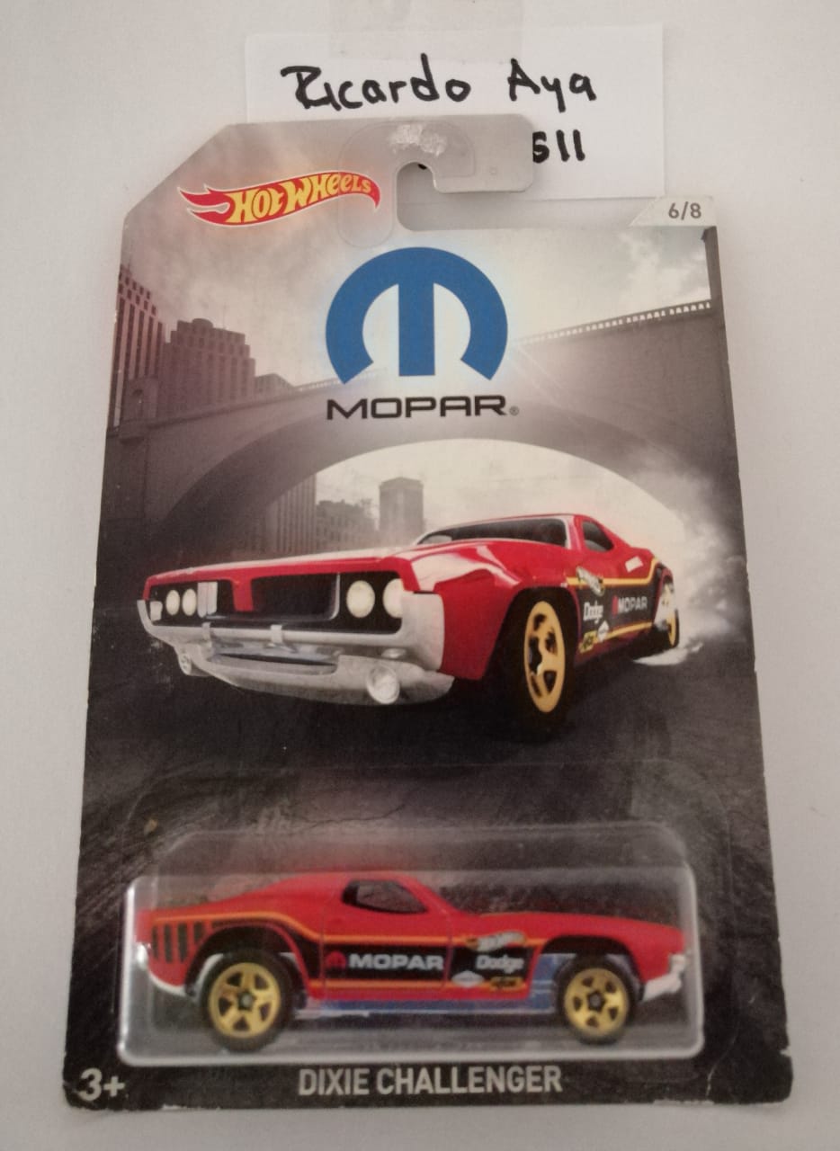 Front of satchel with blue canvas body, black straps and handle, drawstring top, and front zipper pouch.