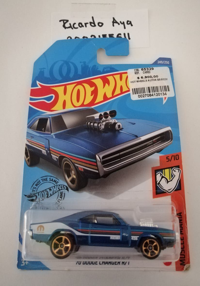 Front of satchel with blue canvas body, black straps and handle, drawstring top, and front zipper pouch.