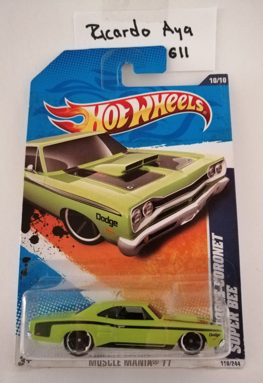 Front of satchel with blue canvas body, black straps and handle, drawstring top, and front zipper pouch.