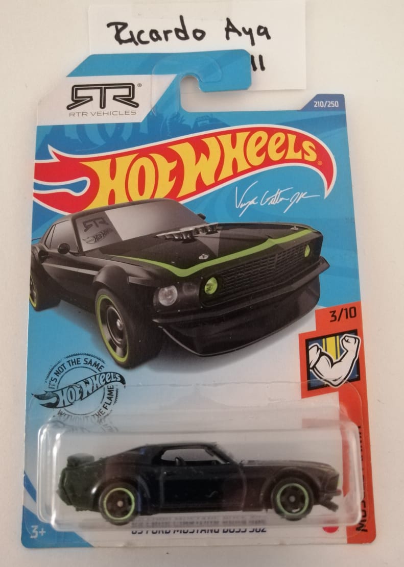 Front of satchel with blue canvas body, black straps and handle, drawstring top, and front zipper pouch.