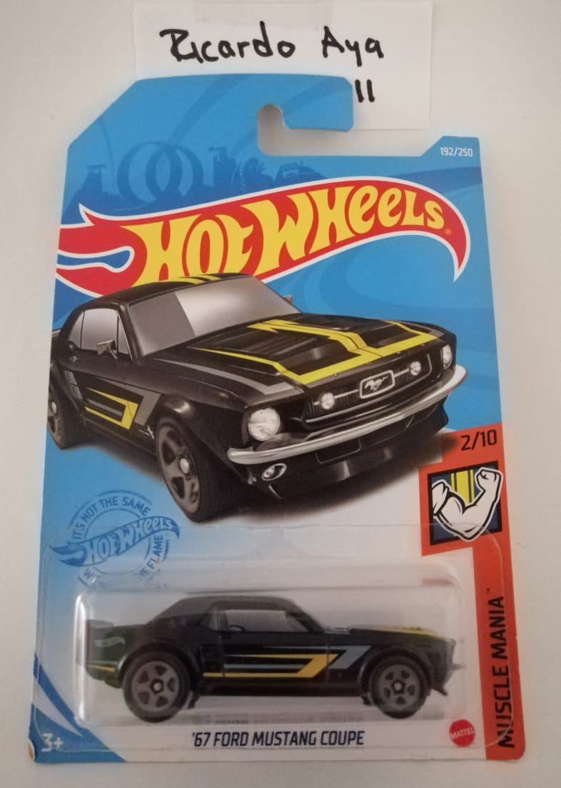 Front of satchel with blue canvas body, black straps and handle, drawstring top, and front zipper pouch.