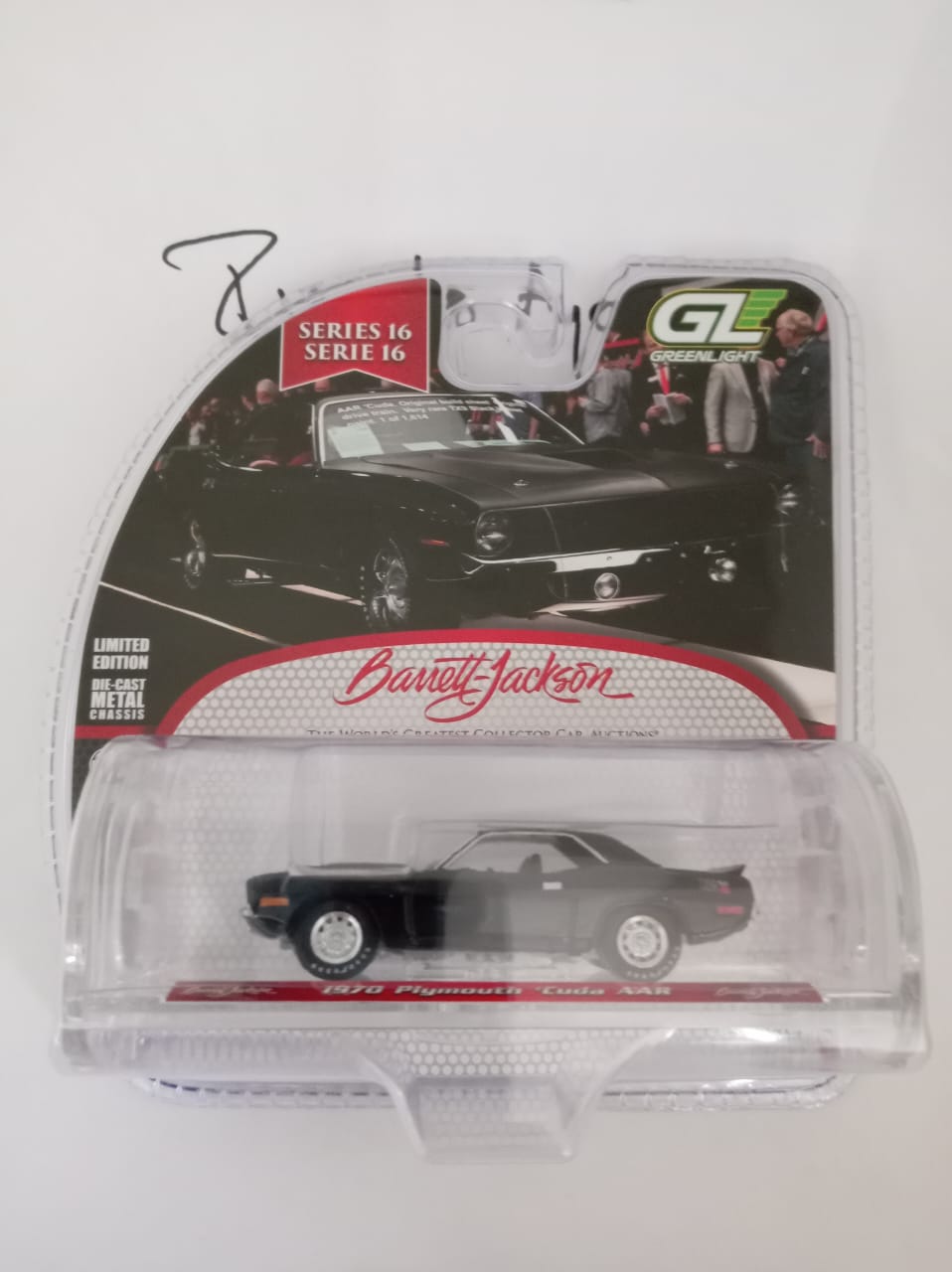 Front of satchel with blue canvas body, black straps and handle, drawstring top, and front zipper pouch.