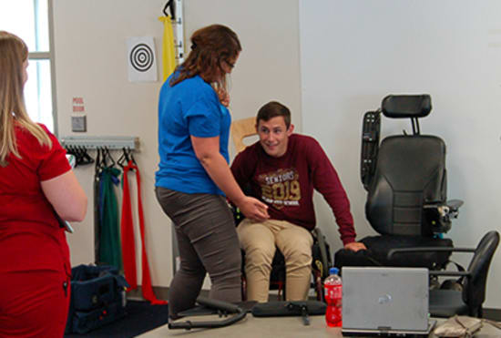 Hunter interacts with Katie Kelley, occupational therapist, and Meghan Stayton, occupational therapist assistant.