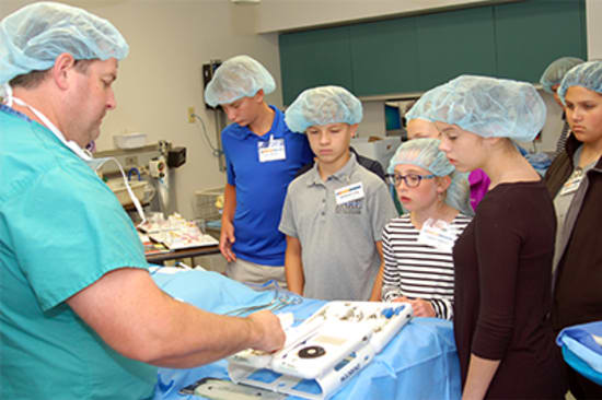 Students in the 2017 Career Camp learn about surgical instruments.