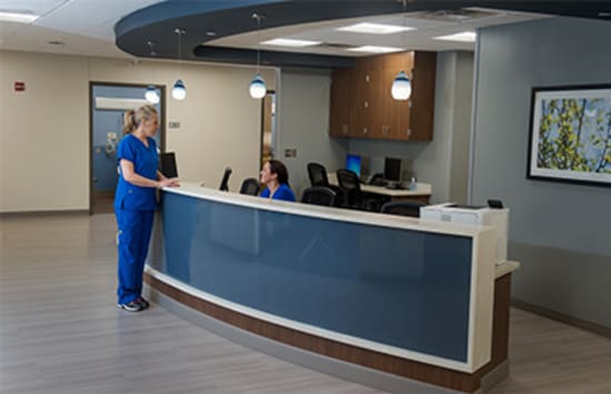 Mary Larsen, R.N., and Jennifer Stafford, R.N., interact at a nurse’s station inside the newly remodeled Lake Regional Outpatient Services Department.