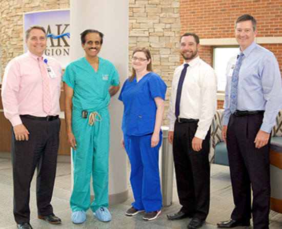 Michael Burcham, vice president of Physician Practices; Cardiologist Muthu Krishnan, M.D., FACC; Travis Messer, director of Specialty Group - Medical Division; and Dane W. Henry, CEO, present Sara Clemmons, LPN, with the Licensed Practical Nurse of the Year award.
