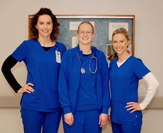 Amy Kempf, Critical Care lead, and Erin Whitcomb, director of Critical Care, present Staci Potts, R.N., with the Spirit of Nursing award.