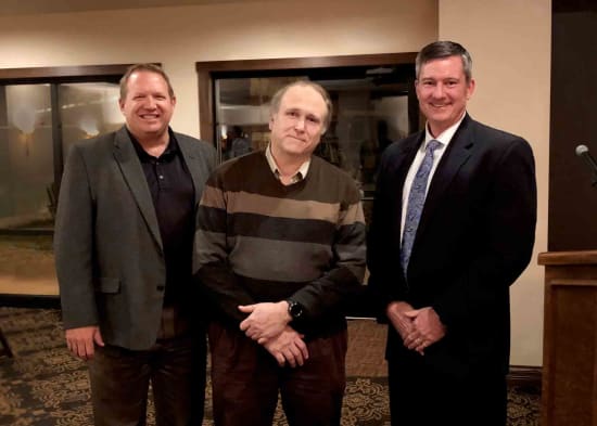 Lake Regional 2018 Physician of the Year Philip Kurle, M.D., stands between Corey ten Bensel, president of the Lake Regional Health System Board of Directors, and Dane W. Henry, Lake Regional CEO.