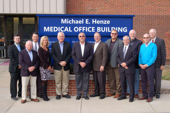 Michael E. Henze, center, stands with members of the Lake Regional Health System Board of Directors. Left to right are John Patton, D.O., FACOS; Larry Shields; Alan Mead, M.D.; Karen Faiferlick; Wayne Compton; Henze; Robert Schwendinger; Corey ten Bensel; James Judas; Charles McElyea; John Caine; and John Parrish.