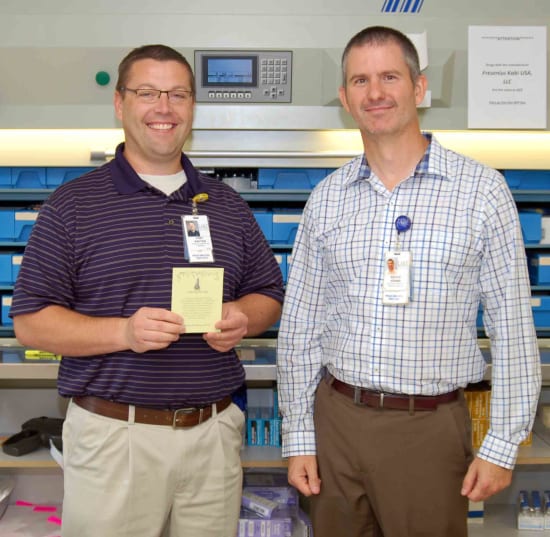 Tony Kauten, PharmD, winner of the Beacon of Clinical Excellence, and Bruce Adams, HR assistant director