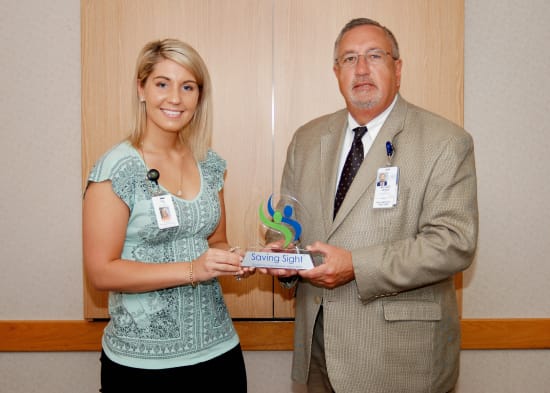 Haley Lyne, partner relations coordinator for Saving Sight, visited Lake Regional Health System to present CEO Michael E. Henze with Saving Sight’s 2016 Excellence in Eye Donation Award on April 25.