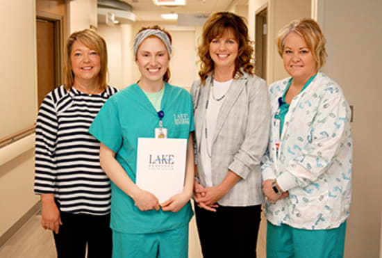 Carissa Crooks, R.N., center left, receives her Rookie of the Year award from Mary Lou Gamm, RNC-OB, Women’s and Children’s Services director; Melissa Hunter, R.N., MSN, senior vice president of Clinical Services; and Trish Jung, RNC, lead nurse, Family Birth Center.