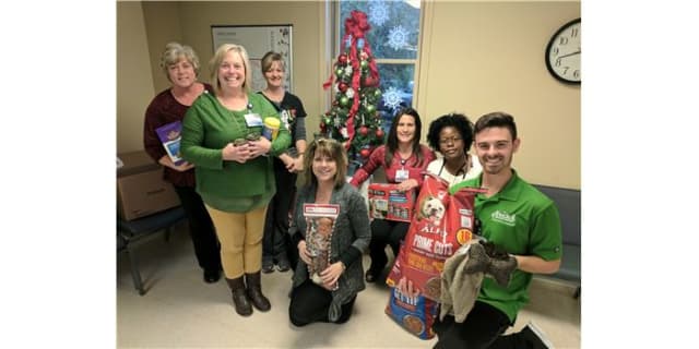Staff in the Cardiopulmonary Rehabilitation department hold donations for the Iredell County Animal Shelter. (From Left to Right): Angela Little, Lisa Warren, Amy Henry, Valerie York, Angela Lanier, Lisa Tate, Jacob Cozart
