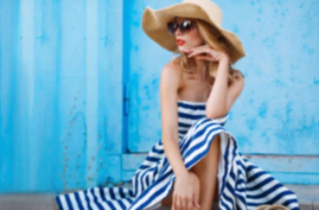 glamorous woman in large hat