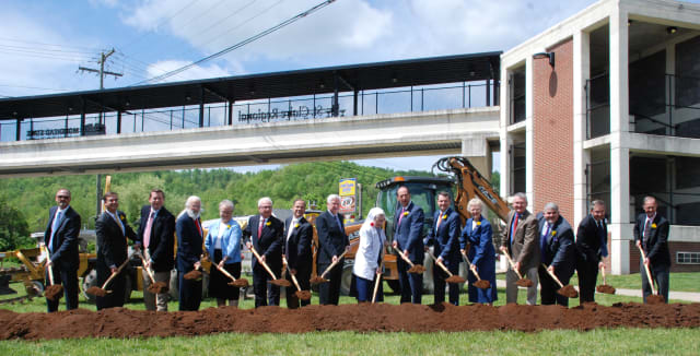 group with shovels at groundbreaking