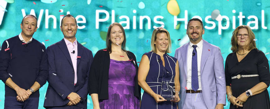 White Plains Hospital Chief Nursing Officer Kerri Elsabrout (third from right) and Clinical Quality Nurse Michelle Elsener (third from left) proudly accept the 2025 American Nurses Credentialing Center Magnet Prize® during the ANCC Magnet & Pathway Conference.