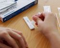 Person prepping their COVID-19 test.
