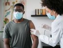 A young man getting a vaccine.