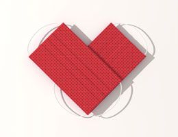 Two red face masks overlap in the shape of a heart.