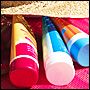 Brightly colored tubes of sunscreen.