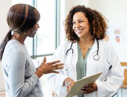 A woman talks to her doctor.