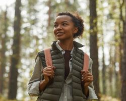 A young woman enjoying time in the woods.