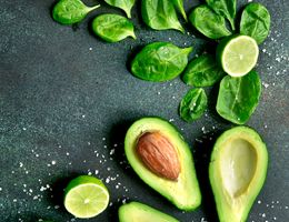 Half an avocado on a cutting board