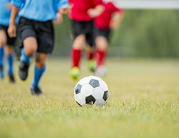 Children playing soccer. 