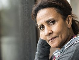 A woman stares intently.