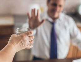 Man declining a drink.