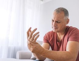 A man massages his hand