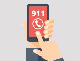 An illustration of a person dialing 911 from their smartphone.