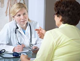 A women is talking to her doctor.