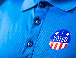 A blue shirt with an "I voted" sticker.
