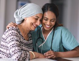 Two women smiling.