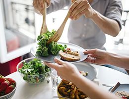 Two people eating a healthy meal.