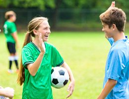 A group of teen or preteen soccer players.