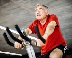 A man using a stationary bike.