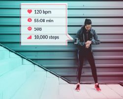 A woman's fitness tracker results are shown: heart rate of 120 bpm, a time of 55:08, 508 calories and 10,000 steps.