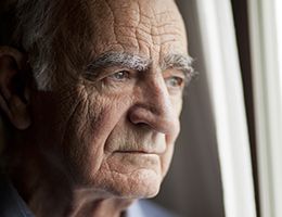 A close-up of a face of an older man.