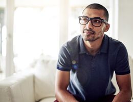 A man sits on a couch