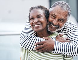 A man hugging a woman.