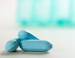 Three blue tablets sitting on a counter.