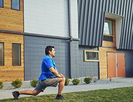 A man stretching outside before exercising.