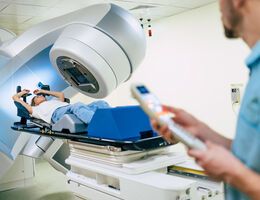 A woman in a radiation therapy machine.