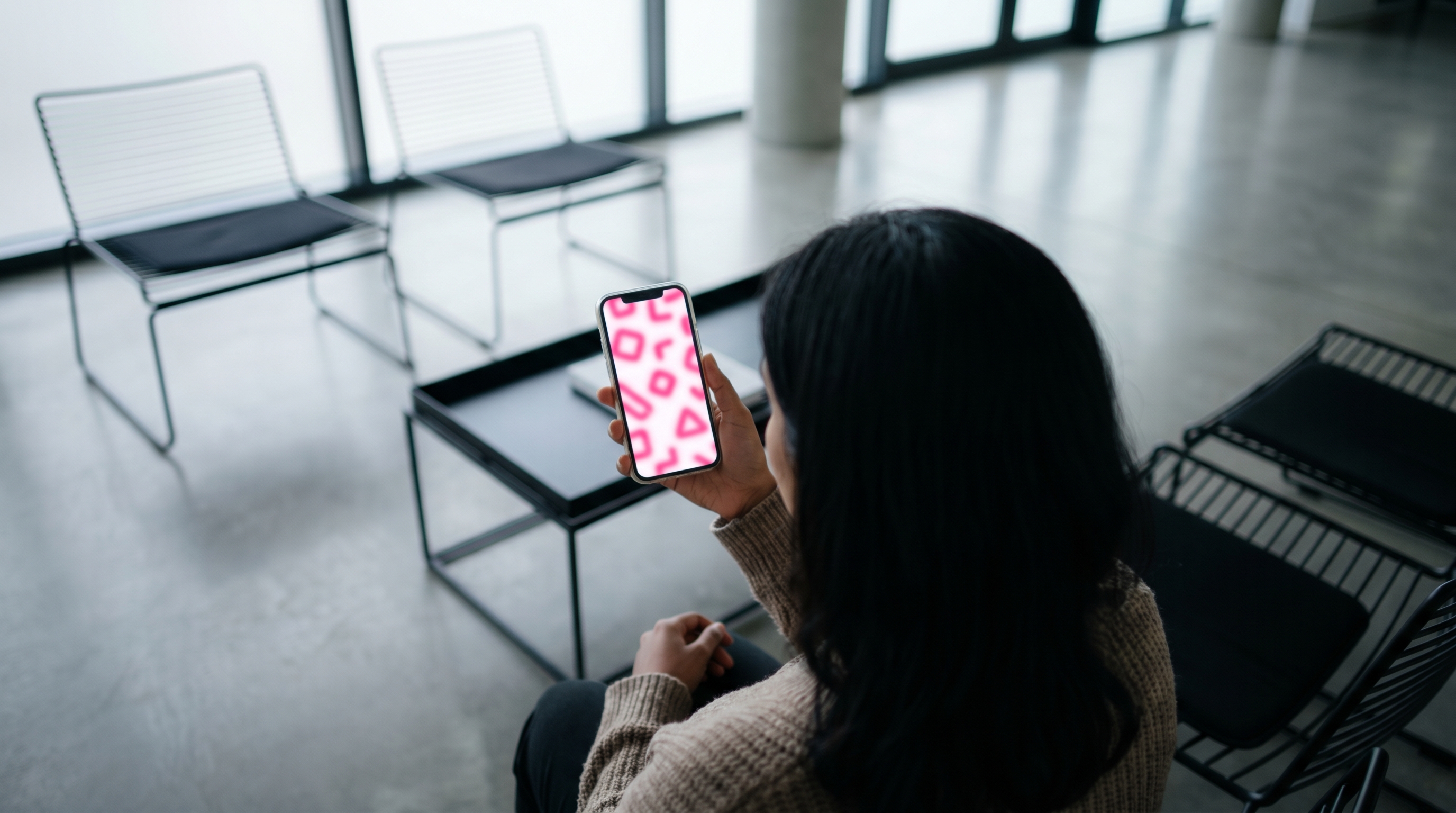 An Indian Malaysian patient using a seamless digital booking portal on a smartphone.