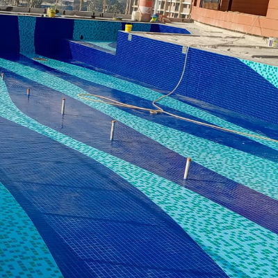 VM Enterprise Precision installation of glass mosaic tiles for pools, jacuzzis, and water features with aesthetic and functional quality Image